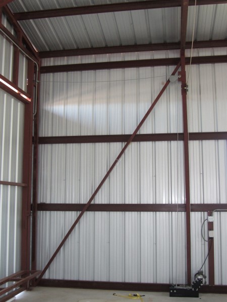 Mechanized cable pulley block system used for airplane hangar door application