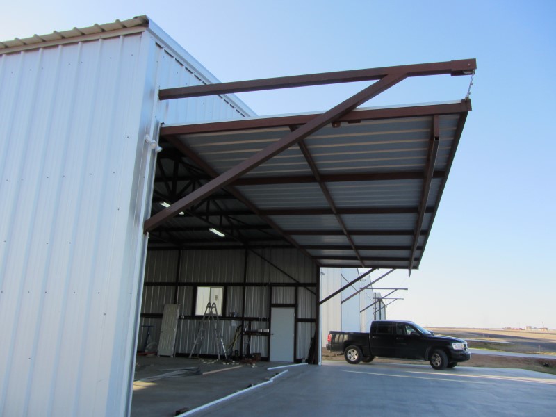 Airplane hangar doors opened using BlockDivision cable pulley block system