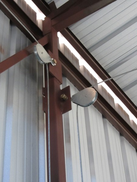 Fixed eye pulley blocks used for airplane hangar door application