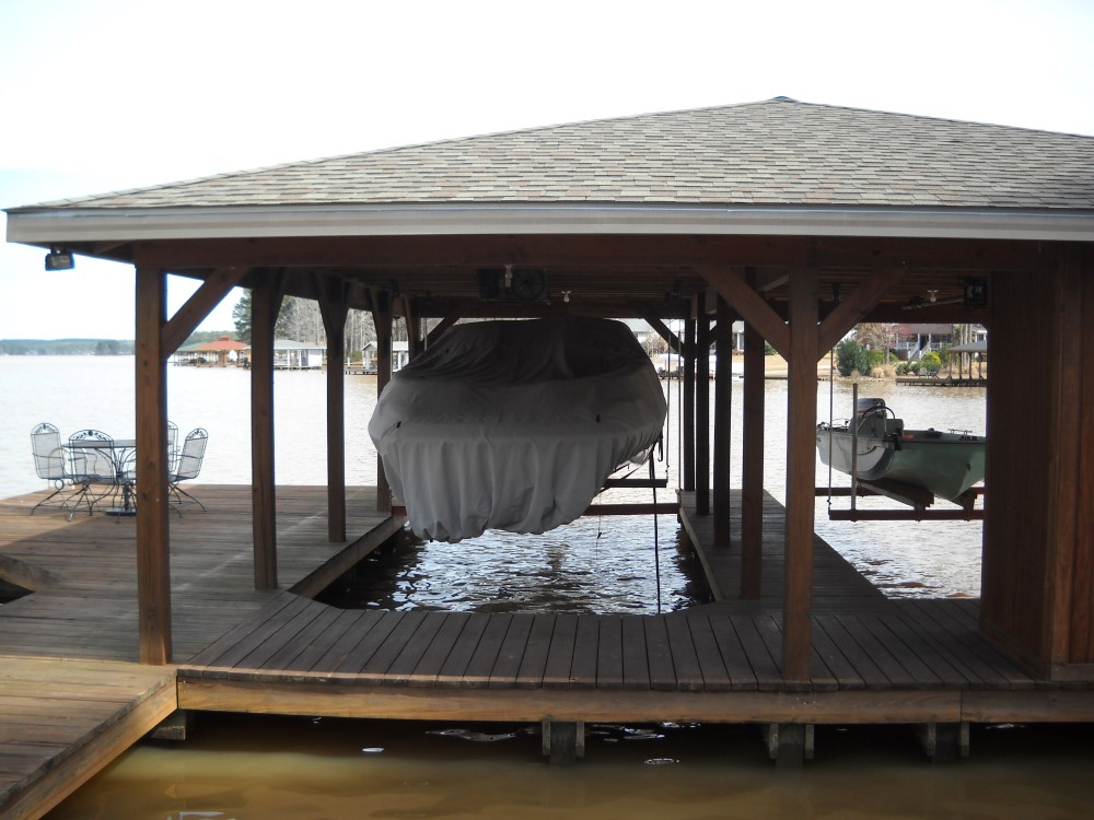 Boat lifted and stored safely using customized cable pulley block sheave