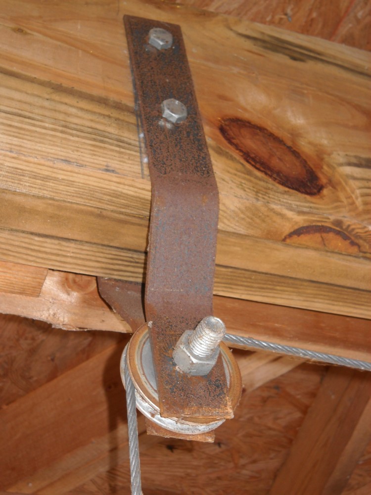 View of a custom sheave pulley designed that has been in use for a long time in lifting a boat out of the water for easy storage
